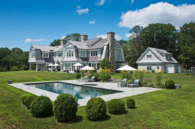 Large country backyard rectangular and stone lap hot tub photo in New York