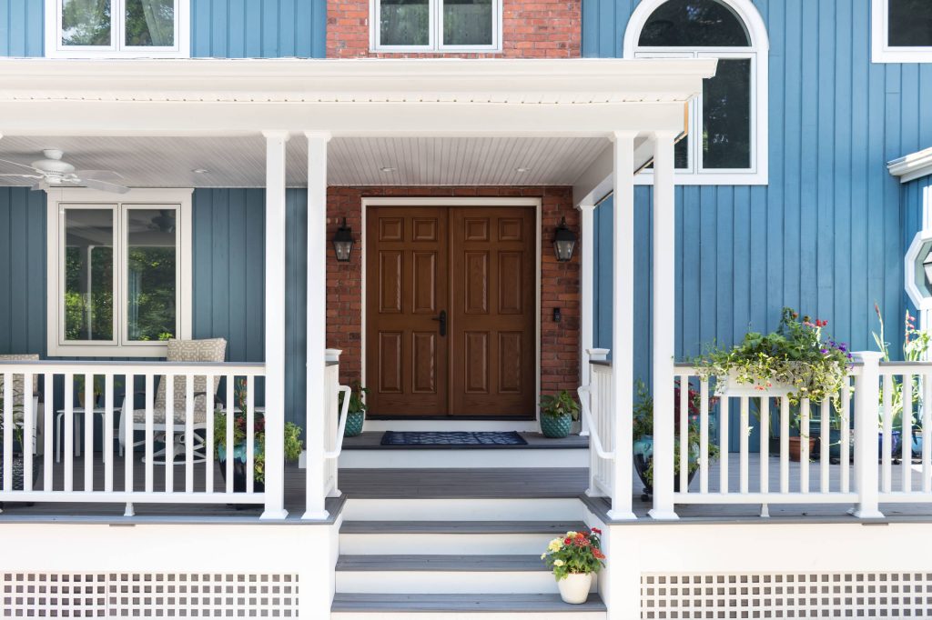 Large country front porch photo in Other with decking and a roof extension by Taylor Bryan Company | Outdoor Photos | Porch | Landscaping | Landscape Design | Outdoor Living Space | Porch Design Ideas | Outdoor Living Space Ideas | Backyard Design