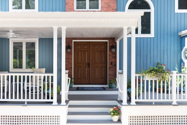 Large country front porch photo in Other with decking and a roof extension by Taylor Bryan Company | Outdoor Photos | Porch | Landscaping | Landscape Design | Outdoor Living Space | Porch Design Ideas | Outdoor Living Space Ideas | Backyard Design