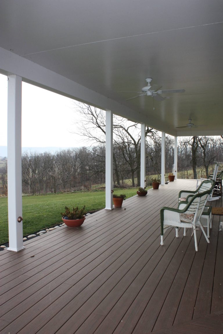 Large country porch idea in Other with decking and a roof extension by Lineage Architects | Outdoor Photos | Porch | Landscaping | Landscape Design | Outdoor Living Space | Porch Design Ideas | Outdoor Living Space Ideas | Backyard Design