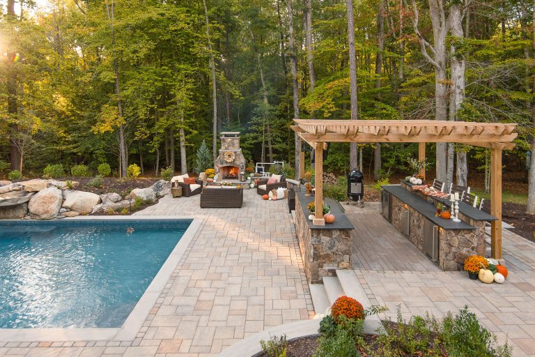 Large elegant backyard concrete paver and rectangular pool fountain photo in Richmond