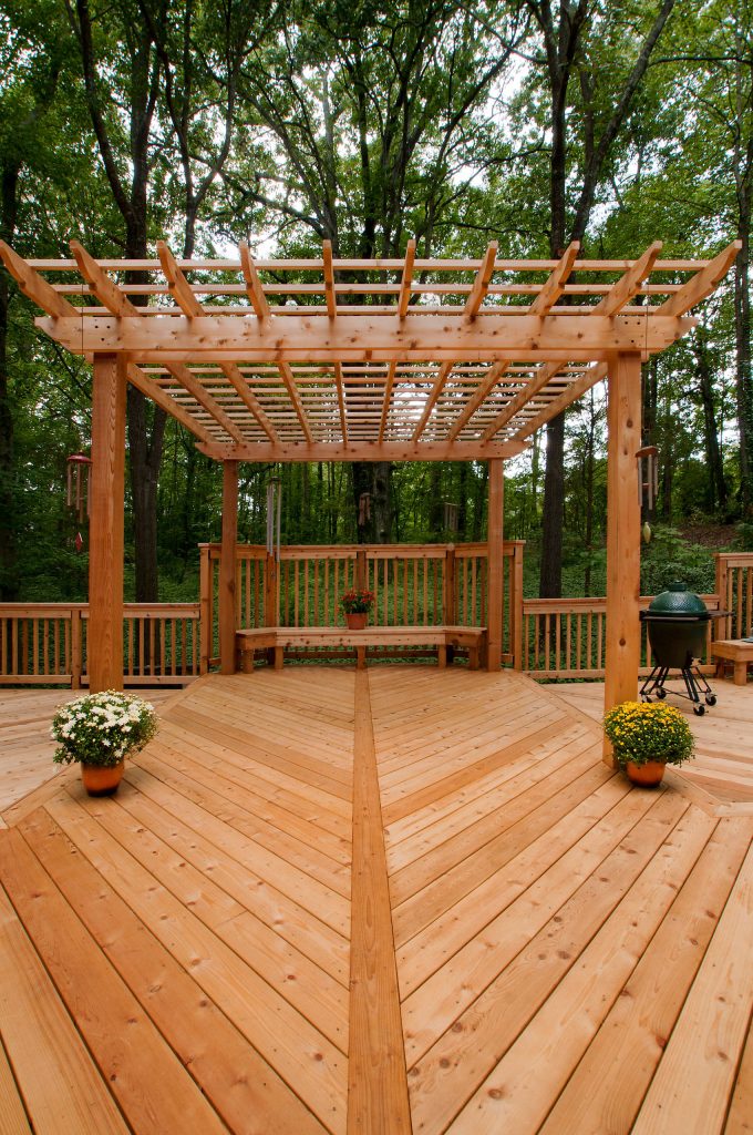 Large elegant backyard outdoor kitchen deck photo in Atlanta with a pergola