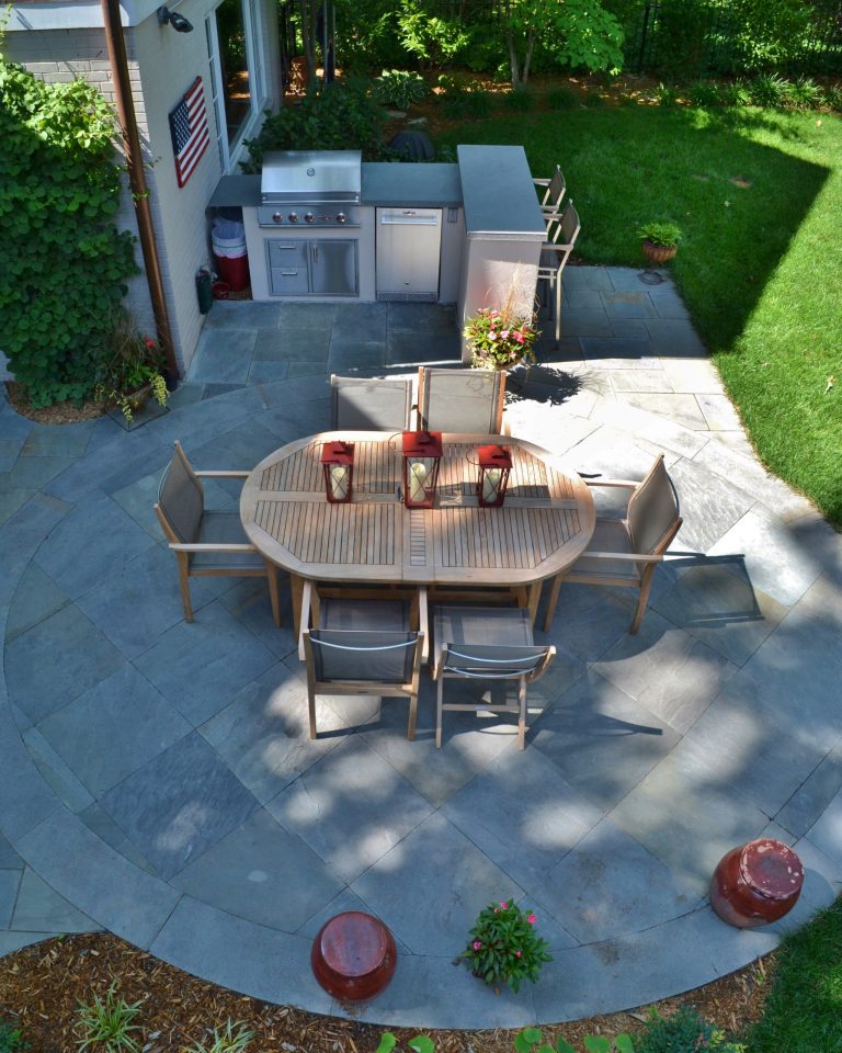 Large elegant backyard stone patio kitchen photo in DC Metro with no cover