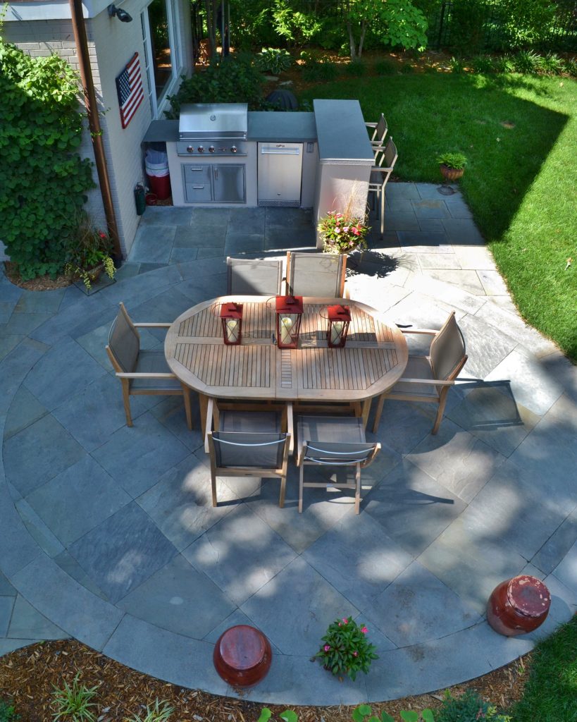 Large elegant backyard stone patio kitchen photo in DC Metro with no cover