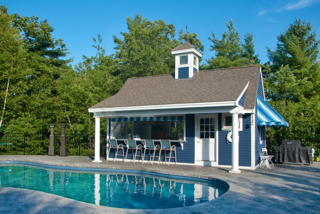 Large elegant backyard stone patio kitchen photo in Manchester with a gazebo