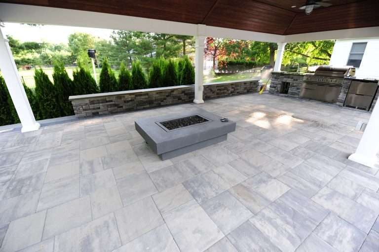 Large elegant backyard stone patio kitchen photo in Philadelphia with a gazebo