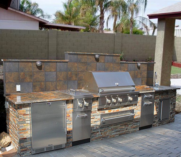 Large elegant backyard stone patio kitchen photo in Phoenix