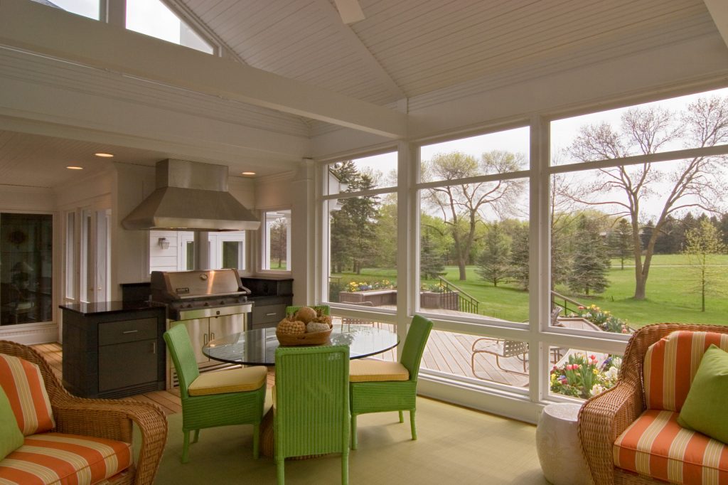 Large elegant screened-in back porch photo in Minneapolis with decking and a roof extension by Quigley Architects | Outdoor Photos | Porch | Landscaping | Landscape Design | Outdoor Living Space | Porch Design Ideas | Outdoor Living Space Ideas | Backyard Design