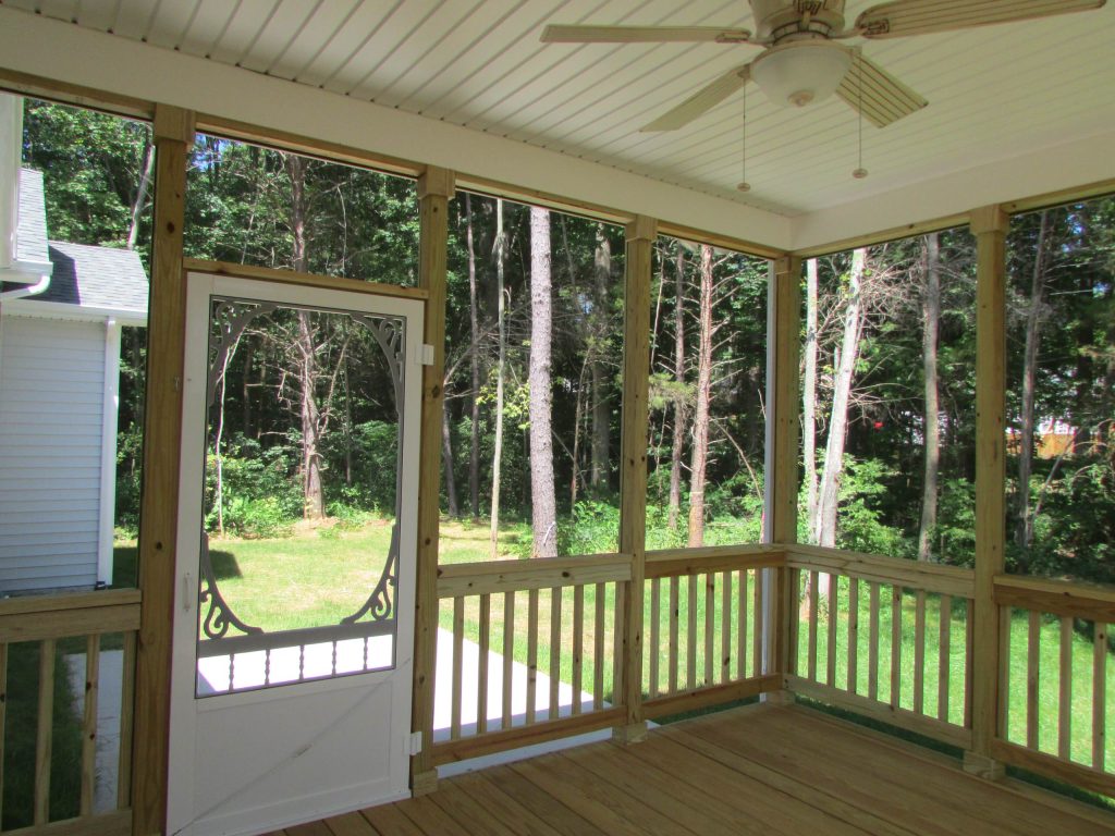Large elegant screened-in back porch photo in Other with decking and a roof extension by Design Craft Homes Inc | Outdoor Photos | Porch | Landscaping | Landscape Design | Outdoor Living Space | Porch Design Ideas | Outdoor Living Space Ideas | Backyard Design