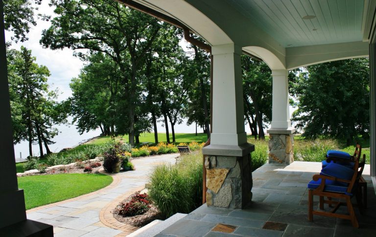 Large elegant stone back porch photo in Milwaukee with a roof extension by McCormack + Etten / Architects LLP | Outdoor Photos | Porch | Landscaping | Landscape Design | Outdoor Living Space | Porch Design Ideas | Outdoor Living Space Ideas | Backyard Design