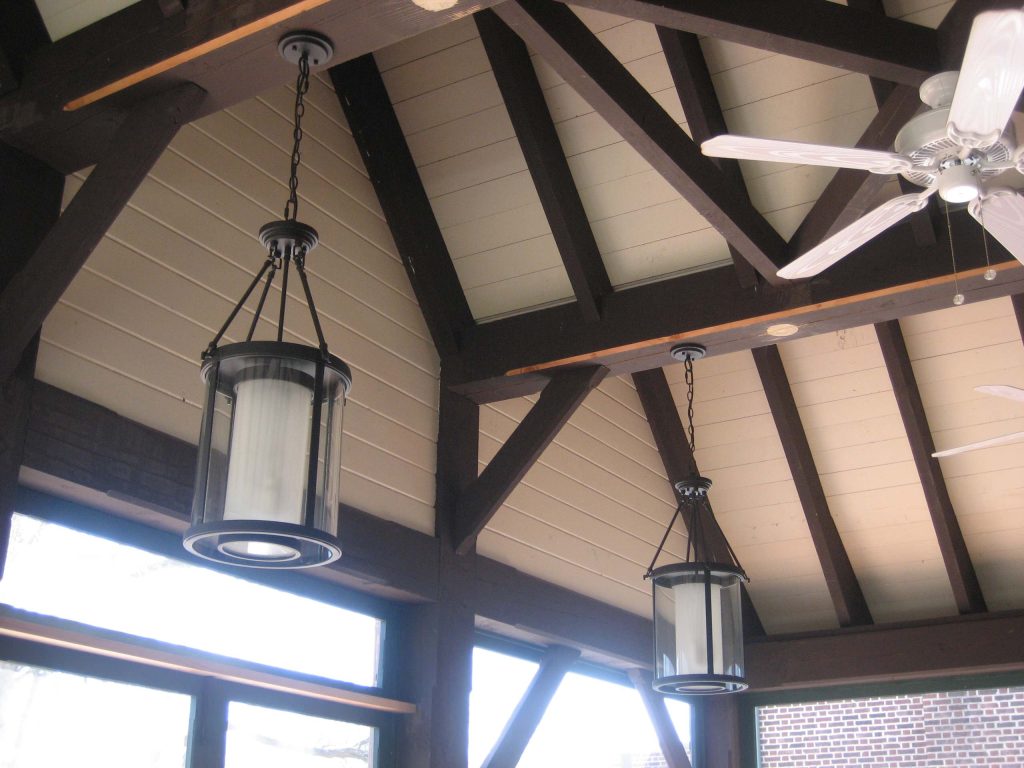 Large elegant stone screened-in back porch photo in Other with a roof extension by Michael Bolster . Architecture | Outdoor Photos | Porch | Landscaping | Landscape Design | Outdoor Living Space | Porch Design Ideas | Outdoor Living Space Ideas | Backyard Design