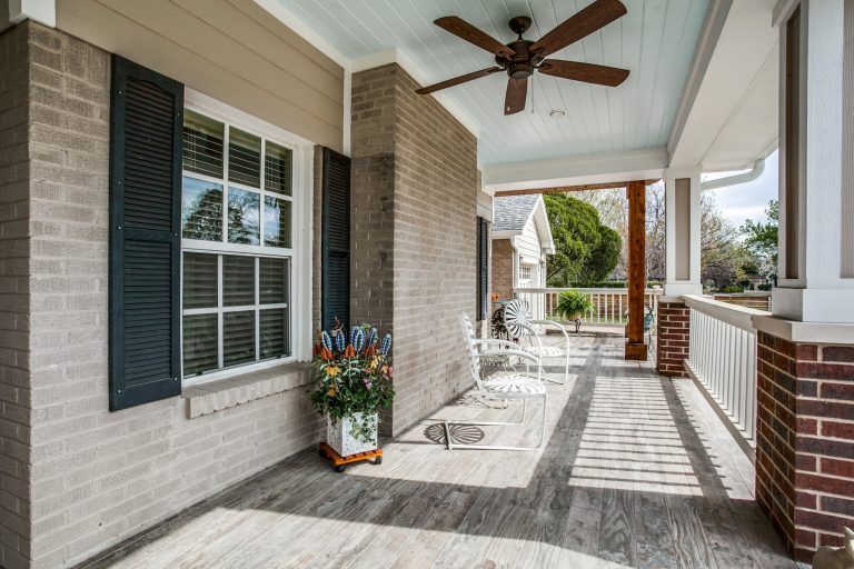 Large elegant tile front porch photo in Dallas with a roof extension by Bella Vista Company | Outdoor Photos | Porch | Landscaping | Landscape Design | Outdoor Living Space | Porch Design Ideas | Outdoor Living Space Ideas | Backyard Design