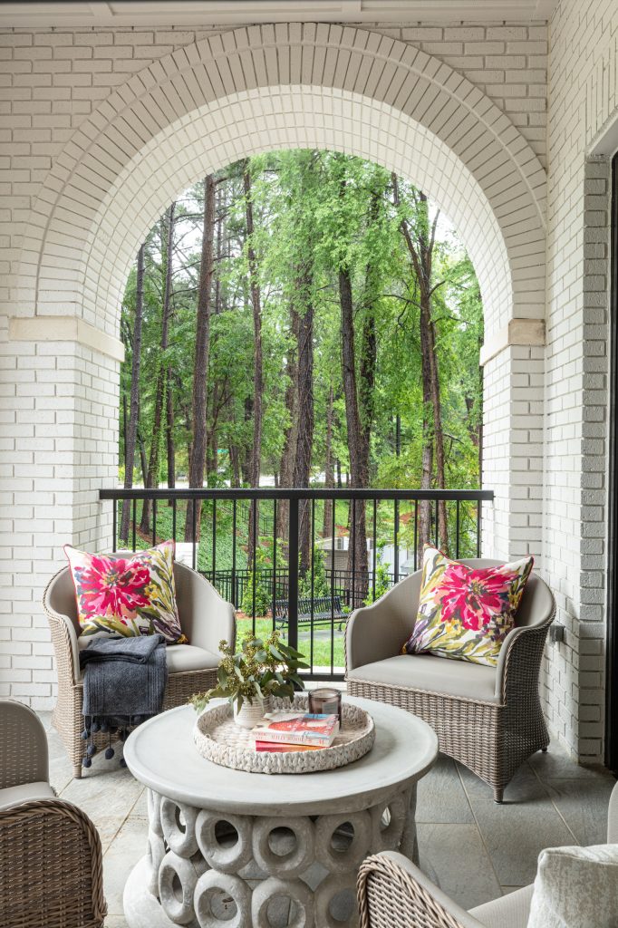 Large elegant tile metal railing porch photo in Raleigh with a roof extension by Beacon Street | Outdoor Photos | Porch | Landscaping | Landscape Design | Outdoor Living Space | Porch Design Ideas | Outdoor Living Space Ideas | Backyard Design