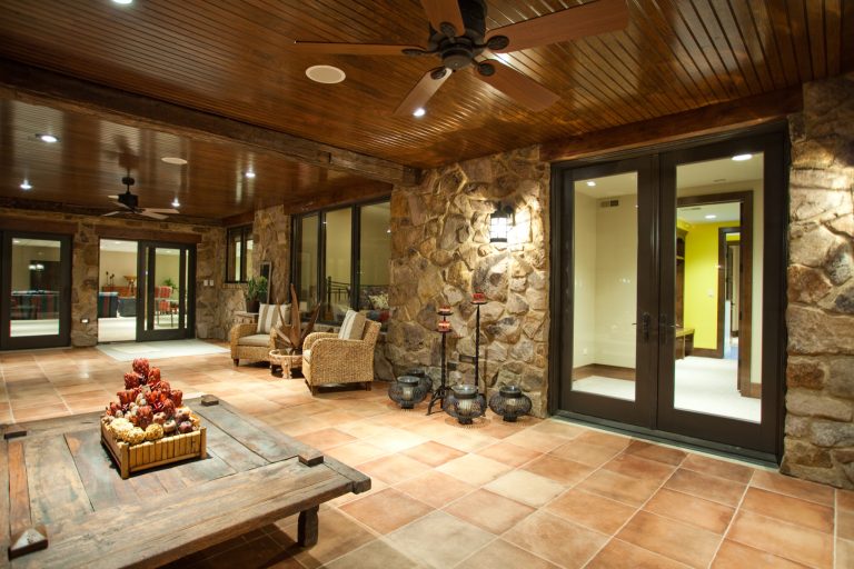 Large elegant tile screened-in back porch photo in Chicago with a roof extension by Gander Builders | Outdoor Photos | Porch | Landscaping | Landscape Design | Outdoor Living Space | Porch Design Ideas | Outdoor Living Space Ideas | Backyard Design