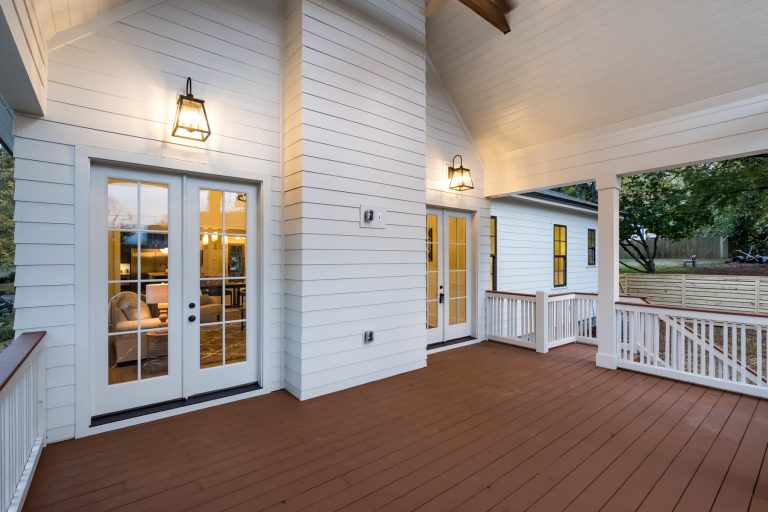 Large farmhouse back porch photo in Charlotte with decking and a roof extension by Pike Properties | Outdoor Photos | Porch | Landscaping | Landscape Design | Outdoor Living Space | Porch Design Ideas | Outdoor Living Space Ideas | Backyard Design