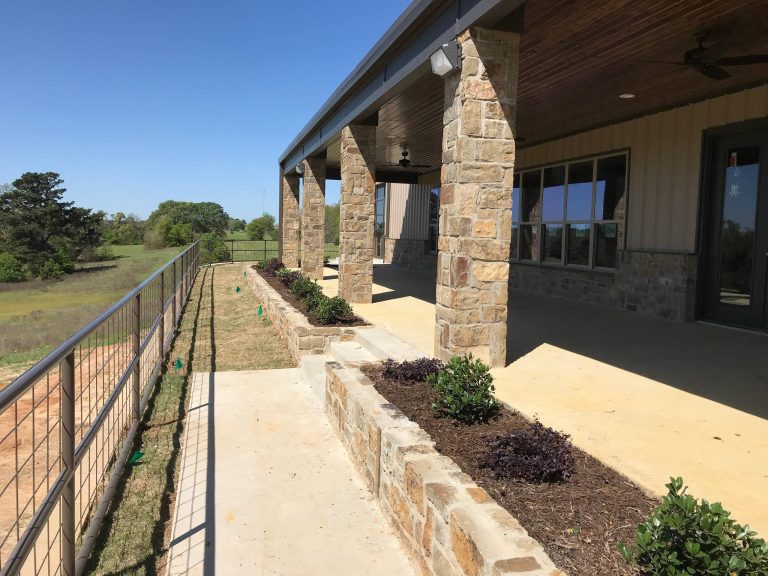 Large farmhouse backyard concrete patio kitchen photo in Dallas with a roof extension