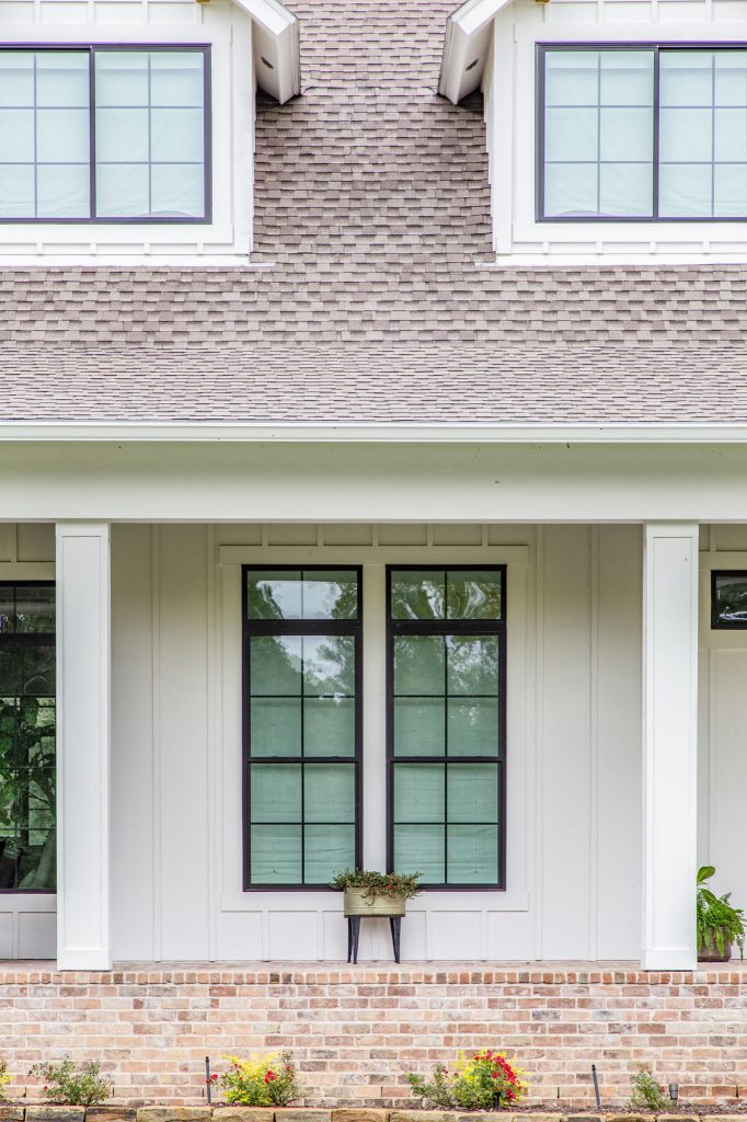 Large farmhouse brick porch photo in Houston with a roof extension by Wyrick Residential Design | Outdoor Photos | Porch | Landscaping | Landscape Design | Outdoor Living Space | Porch Design Ideas | Outdoor Living Space Ideas | Backyard Design