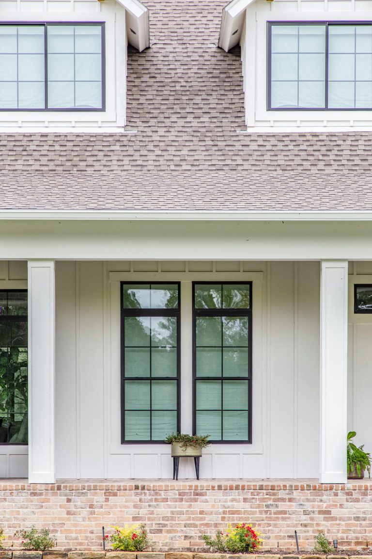 Large farmhouse brick porch photo in Houston with a roof extension by Wyrick Residential Design | Outdoor Photos | Porch | Landscaping | Landscape Design | Outdoor Living Space | Porch Design Ideas | Outdoor Living Space Ideas | Backyard Design