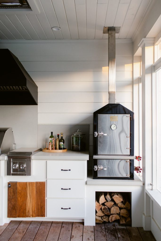 Large farmhouse screened-in back porch photo in Dallas with decking and a roof extension by Folkway Design & Wares Co. | Outdoor Photos | Porch | Landscaping | Landscape Design | Outdoor Living Space | Porch Design Ideas | Outdoor Living Space Ideas | Backyard Design
