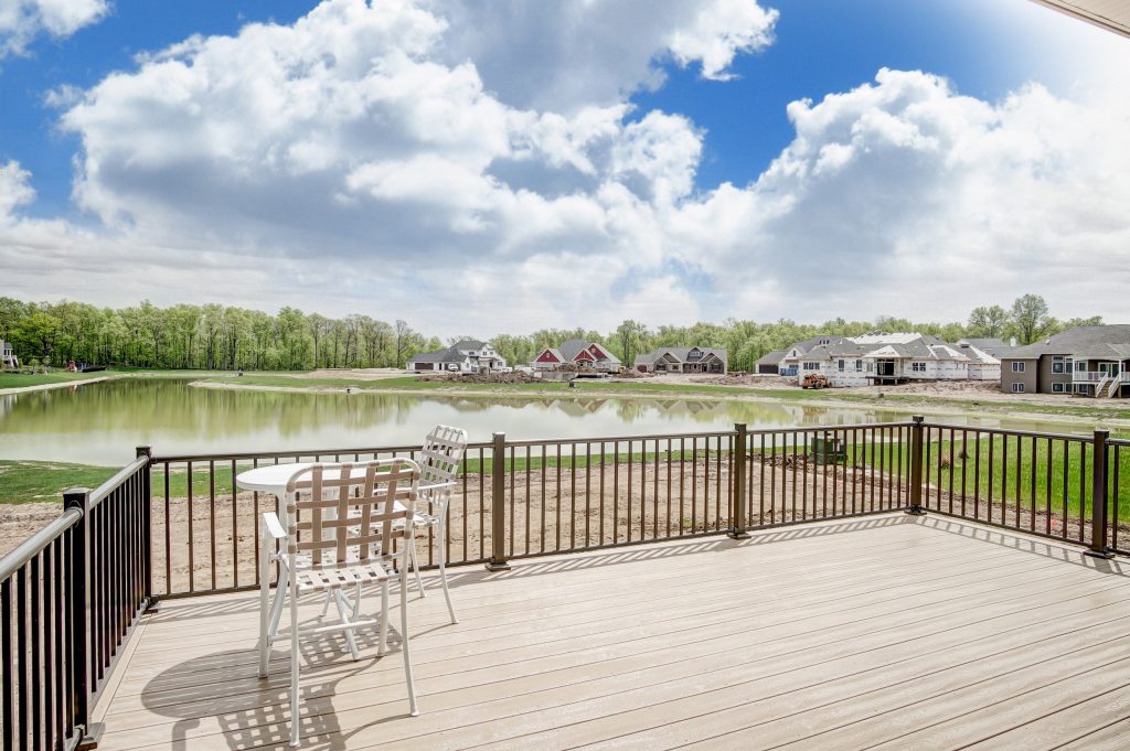 Large minimalist back porch idea in Other with decking and a roof extension by Bob Buescher Homes | Outdoor Photos | Porch | Landscaping | Landscape Design | Outdoor Living Space | Porch Design Ideas | Outdoor Living Space Ideas | Backyard Design