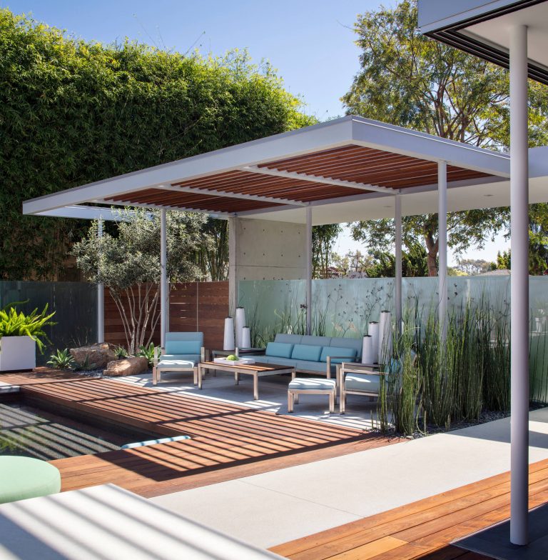 Large minimalist backyard concrete and rectangular pool house photo in San Diego
