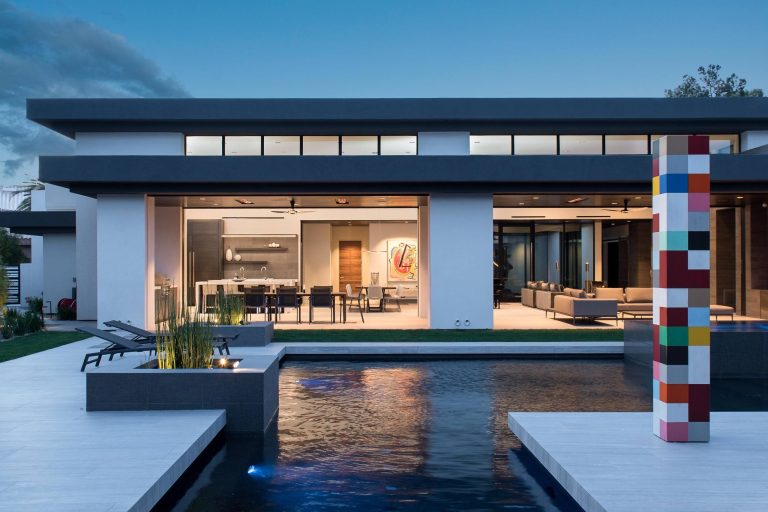 Large minimalist backyard tile and custom-shaped lap hot tub photo in Las Vegas