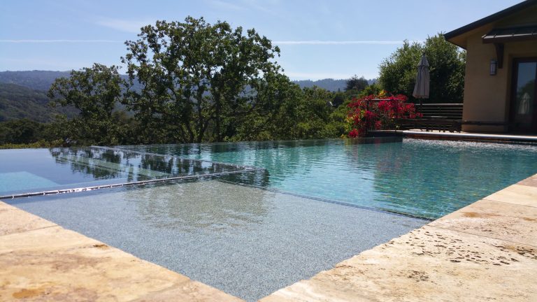 Large minimalist backyard tile and rectangular infinity pool house photo in San Francisco