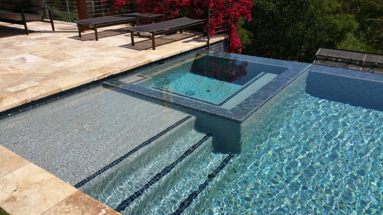 Large minimalist backyard tile and rectangular infinity pool house photo in San Francisco
