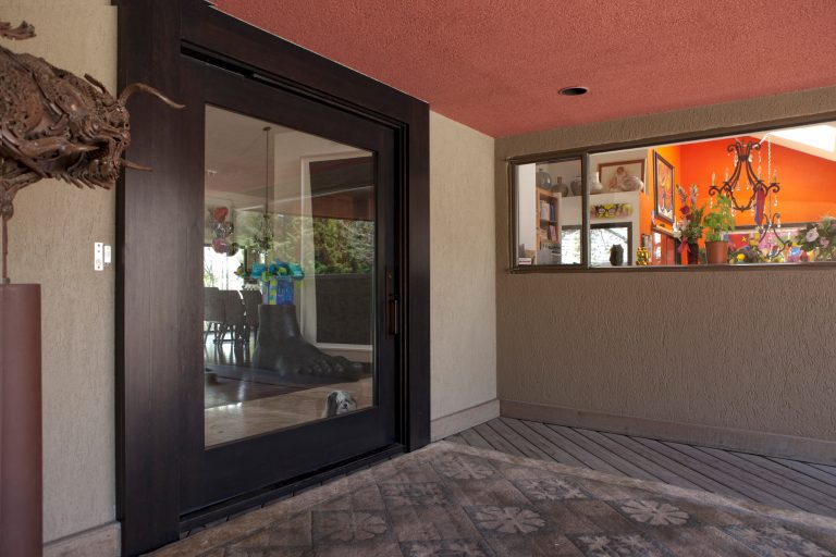 Large minimalist front porch idea in Denver with decking and a roof extension by Castlewood Doors & Millwork | Outdoor Photos | Porch | Landscaping | Landscape Design | Outdoor Living Space | Porch Design Ideas | Outdoor Living Space Ideas | Backyard Design