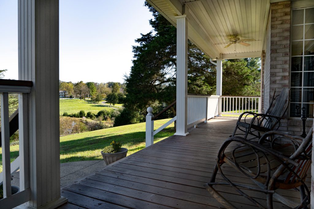 Large minimalist front porch photo in DC Metro by Levi Cheff Photography | Outdoor Photos | Porch | Landscaping | Landscape Design | Outdoor Living Space | Porch Design Ideas | Outdoor Living Space Ideas | Backyard Design