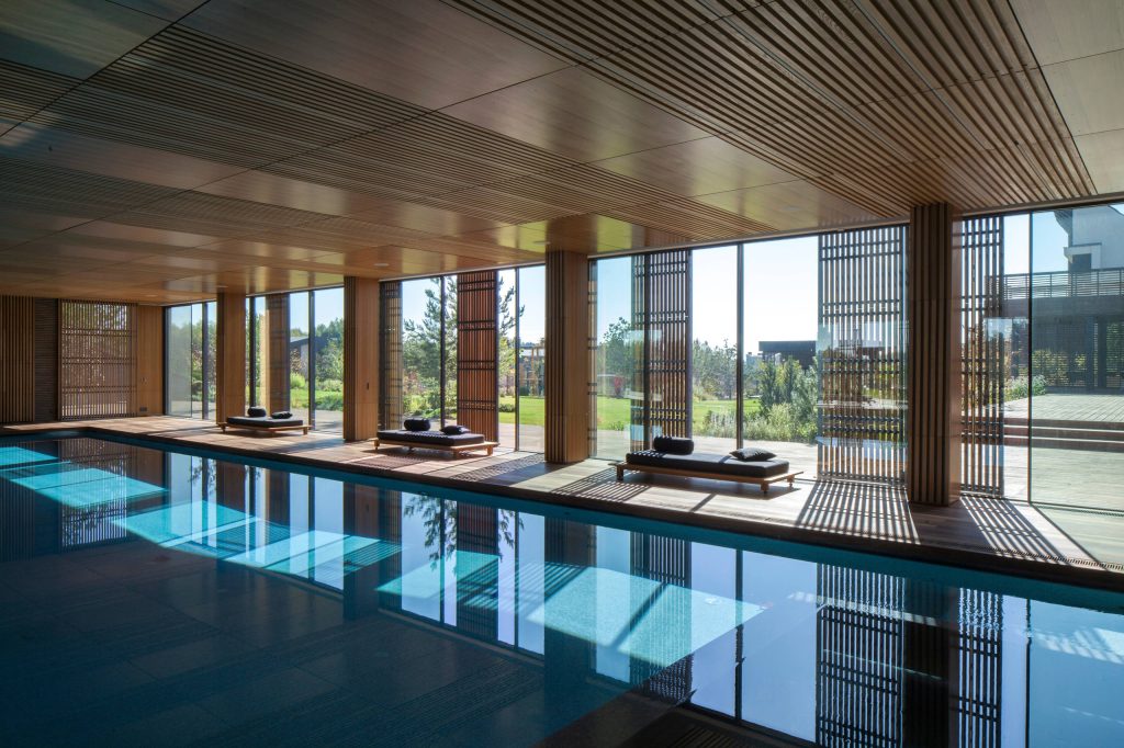 Large minimalist indoor rectangular lap pool photo in San Francisco with decking