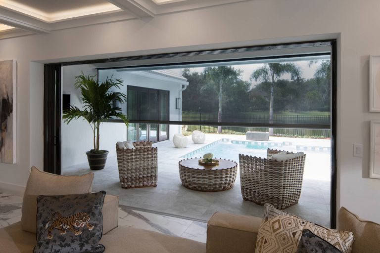 Large minimalist porch photo in Other with a roof extension by Phantom Screens | Outdoor Photos | Porch | Landscaping | Landscape Design | Outdoor Living Space | Porch Design Ideas | Outdoor Living Space Ideas | Backyard Design