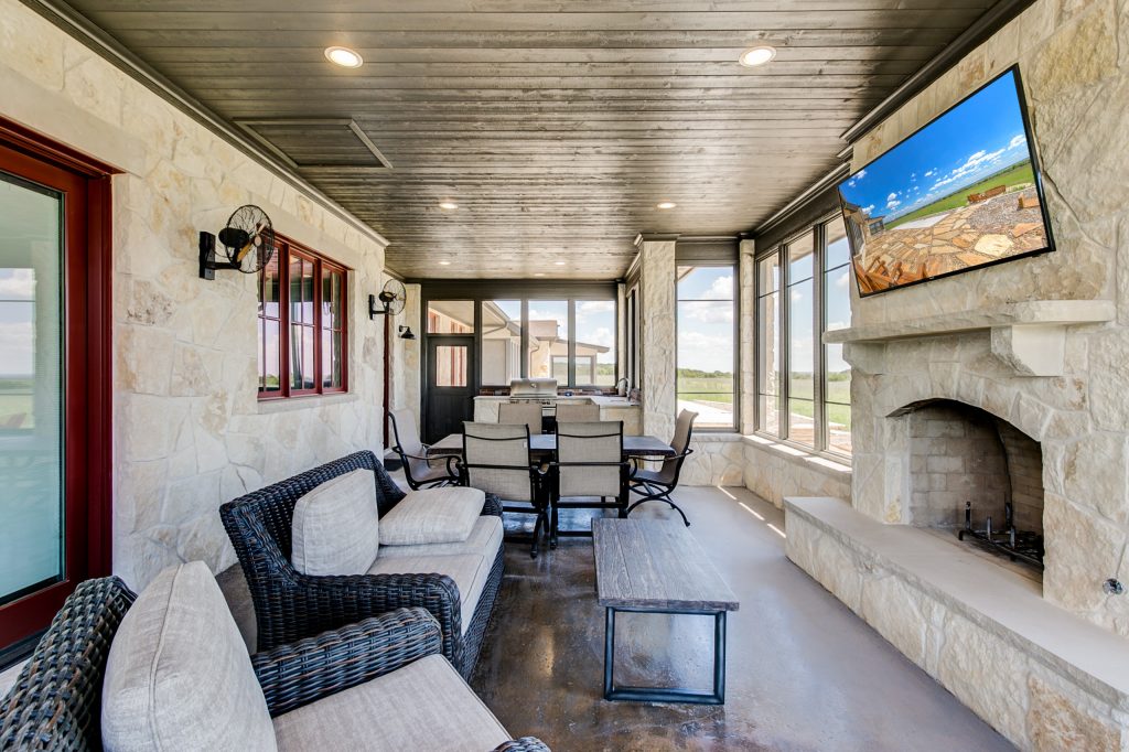 Large mountain style concrete screened-in back porch idea in Dallas with a roof extension by Steve Bumpas Custom Homes | Outdoor Photos | Porch | Landscaping | Landscape Design | Outdoor Living Space | Porch Design Ideas | Outdoor Living Space Ideas | Backyard Design