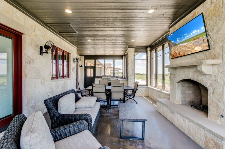Large mountain style concrete screened-in back porch idea in Dallas with a roof extension by Steve Bumpas Custom Homes | Outdoor Photos | Porch | Landscaping | Landscape Design | Outdoor Living Space | Porch Design Ideas | Outdoor Living Space Ideas | Backyard Design