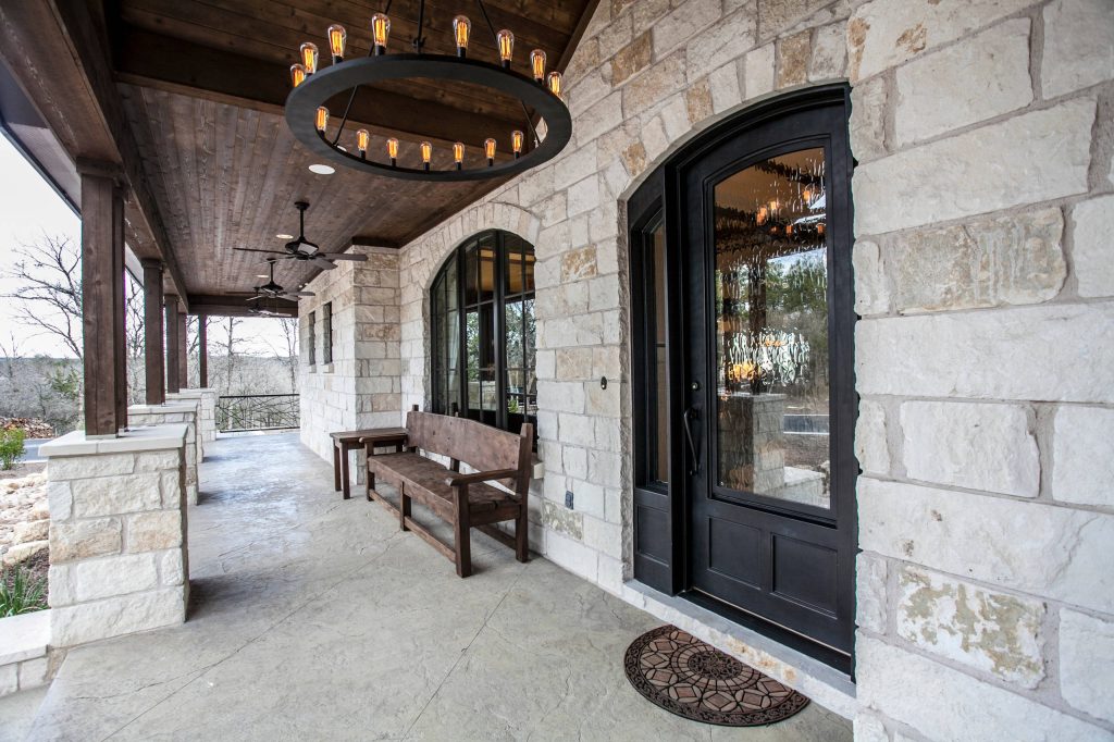 Large mountain style stamped concrete front porch idea in Austin with a roof extension by Strobel & Associates LLC | Outdoor Photos | Porch | Landscaping | Landscape Design | Outdoor Living Space | Porch Design Ideas | Outdoor Living Space Ideas | Backyard Design