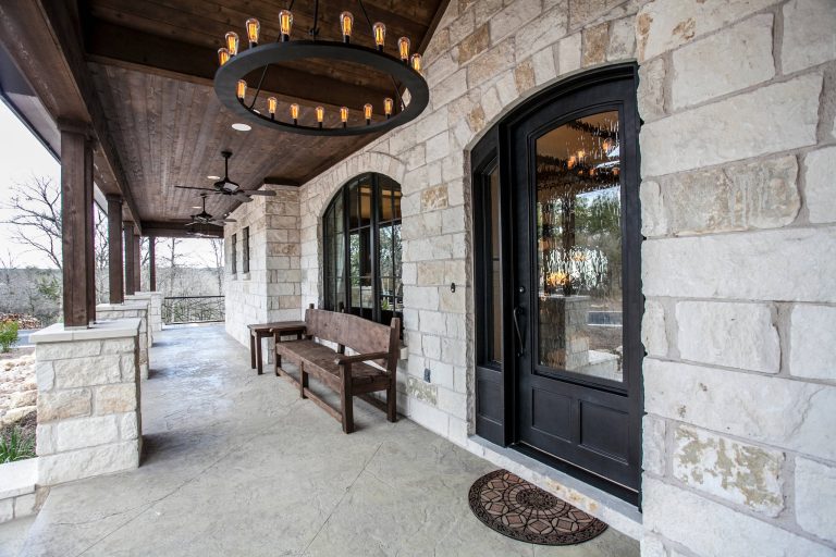 Large mountain style stamped concrete front porch idea in Austin with a roof extension by Strobel & Associates LLC | Outdoor Photos | Porch | Landscaping | Landscape Design | Outdoor Living Space | Porch Design Ideas | Outdoor Living Space Ideas | Backyard Design