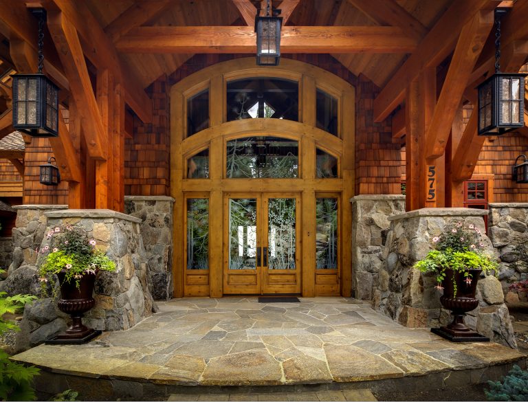 Large mountain style stone porch photo in Orange County with a roof extension by Sierra Nevada Door & Window | Outdoor Photos | Porch | Landscaping | Landscape Design | Outdoor Living Space | Porch Design Ideas | Outdoor Living Space Ideas | Backyard Design