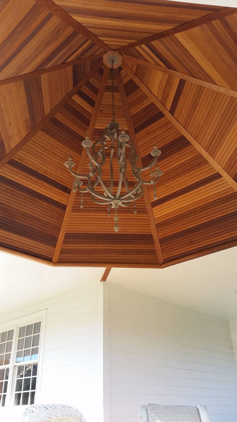 Large ornate front porch photo in New York with decking and a roof extension by Whitbeck Construction LLC | Outdoor Photos | Porch | Landscaping | Landscape Design | Outdoor Living Space | Porch Design Ideas | Outdoor Living Space Ideas | Backyard Design