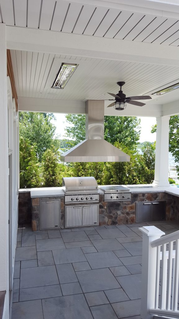 Large outdoor kitchen overlooking the lake. Grill is built-in as well as the cook top and fridge.