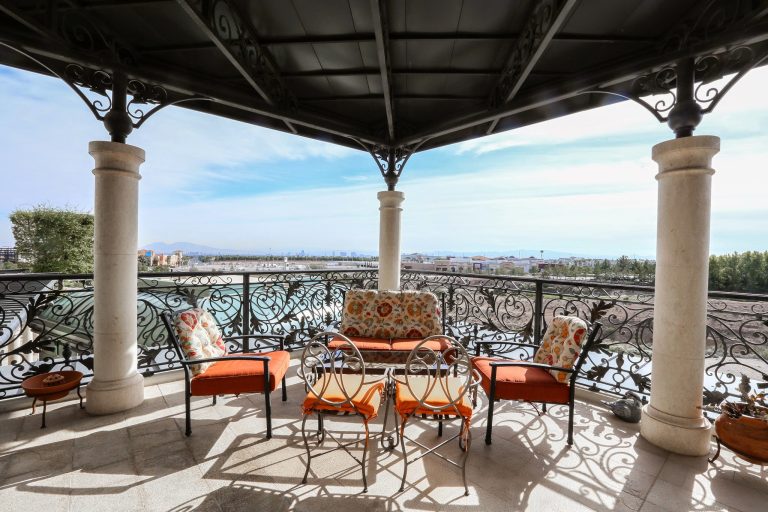 Large porch photo in Las Vegas with an awning by One Queensridge Place | Outdoor Photos | Porch | Landscaping | Landscape Design | Outdoor Living Space | Porch Design Ideas | Outdoor Living Space Ideas | Backyard Design