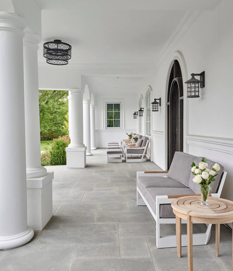 Large porches run the length of the front and rear of the home. Comfortable outdoor seating provides a great spot for arriving guests or children returning from school. by COOK ARCHITECTURAL Design Studio | Outdoor Photos | Porch | Landscaping | Landscape Design | Outdoor Living Space | Porch Design Ideas | Outdoor Living Space Ideas | Backyard Design