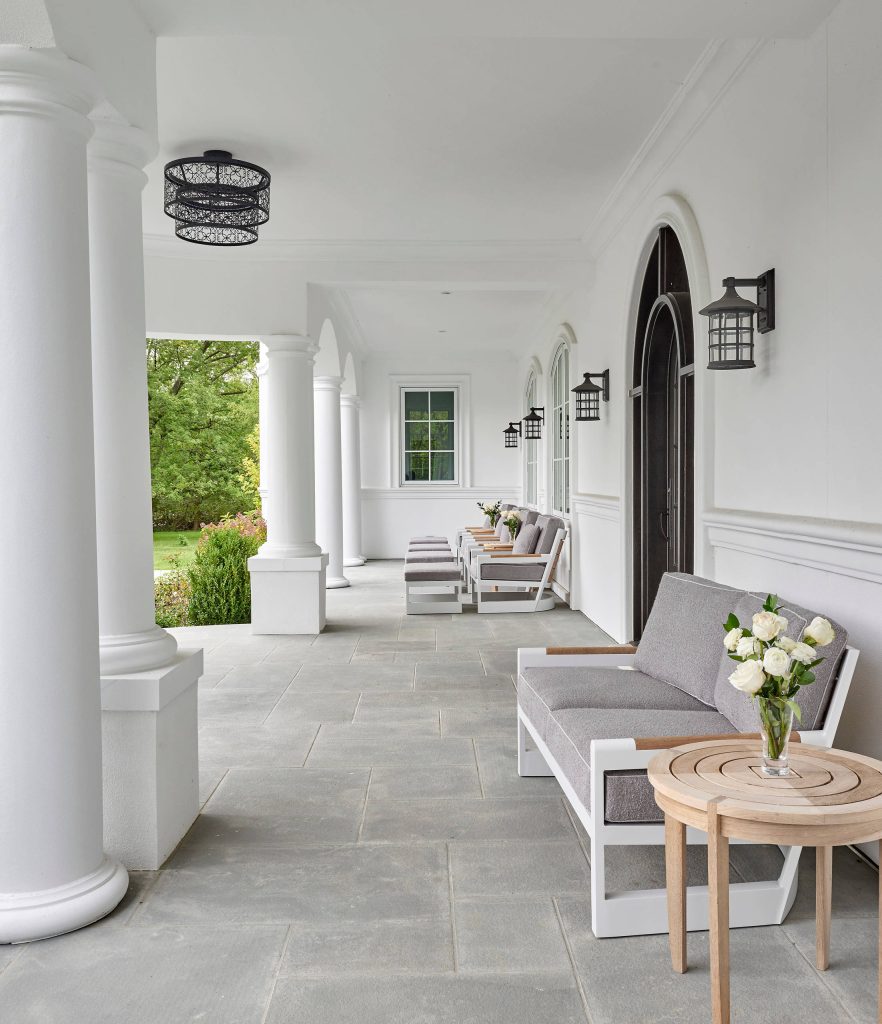 Large porches run the length of the front and rear of the home. Comfortable outdoor seating provides a great spot for arriving guests or children returning from school. by COOK ARCHITECTURAL Design Studio | Outdoor Photos | Porch | Landscaping | Landscape Design | Outdoor Living Space | Porch Design Ideas | Outdoor Living Space Ideas | Backyard Design