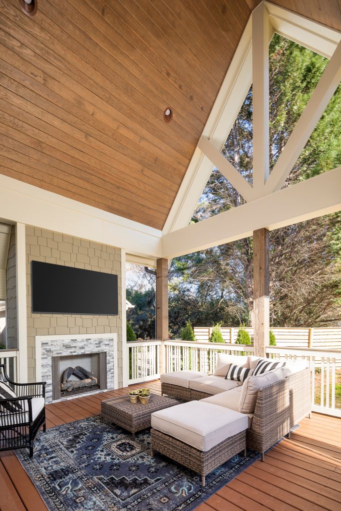 Large transitional back porch photo in Charlotte with a fireplace and a roof extension by Pike Properties | Outdoor Photos | Porch | Landscaping | Landscape Design | Outdoor Living Space | Porch Design Ideas | Outdoor Living Space Ideas | Backyard Design