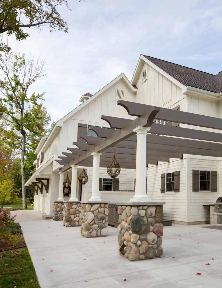 Large transitional backyard concrete patio kitchen photo in Other with a pergola