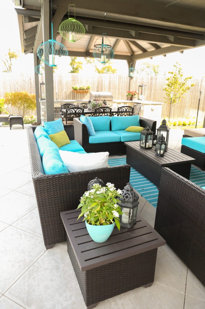 Large transitional backyard concrete paver patio kitchen photo in Other with a gazebo