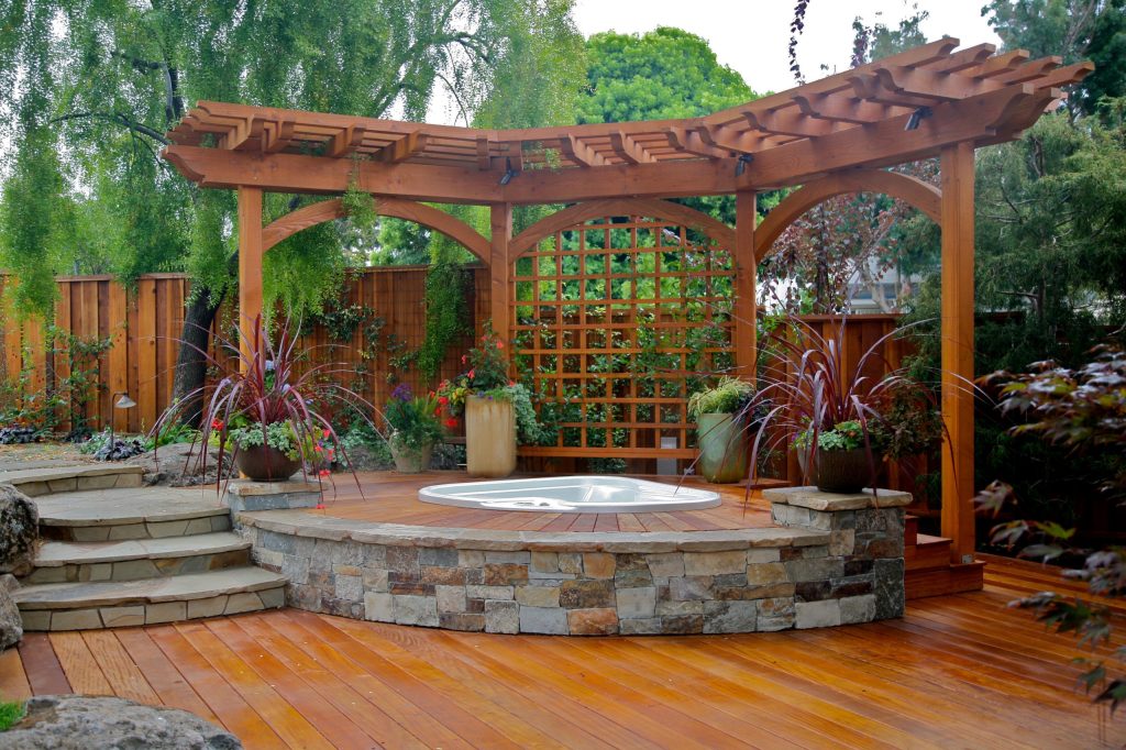 Large transitional backyard deck photo in San Francisco with a pergola