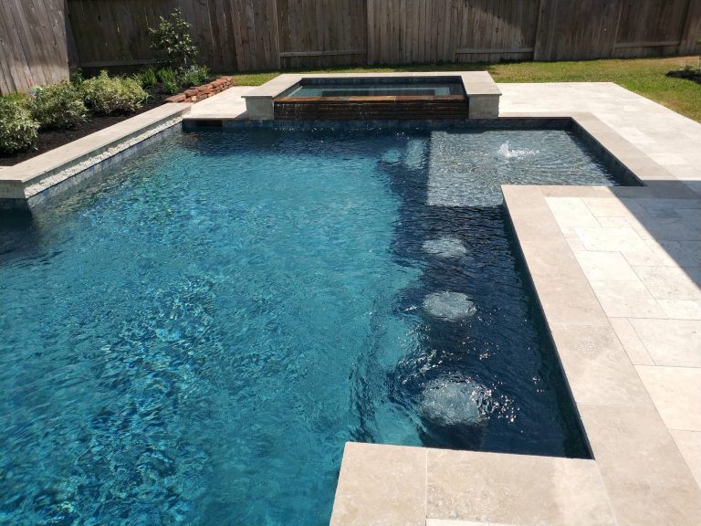 Large transitional backyard stone and rectangular lap hot tub photo in Houston