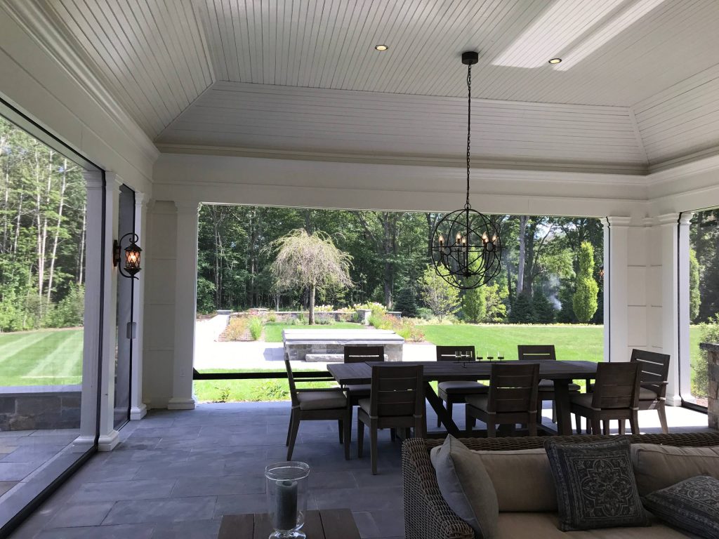 Large transitional backyard tile patio kitchen photo in Boston with a roof extension