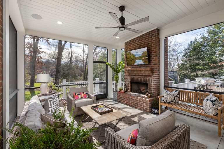 Large transitional front porch photo in Other with a fireplace and a roof extension by CarsonSpeer Builders | Outdoor Photos | Porch | Landscaping | Landscape Design | Outdoor Living Space | Porch Design Ideas | Outdoor Living Space Ideas | Backyard Design