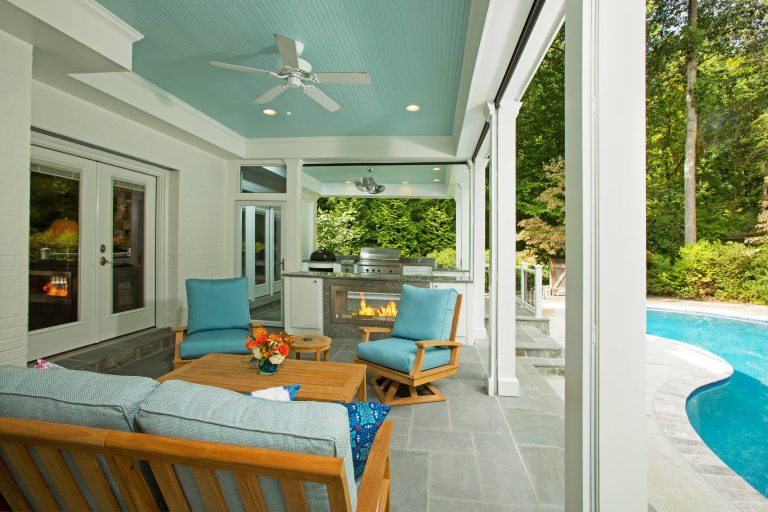 Large transitional stone porch photo in DC Metro with a roof extension by C.E.I. | Outdoor Photos | Porch | Landscaping | Landscape Design | Outdoor Living Space | Porch Design Ideas | Outdoor Living Space Ideas | Backyard Design